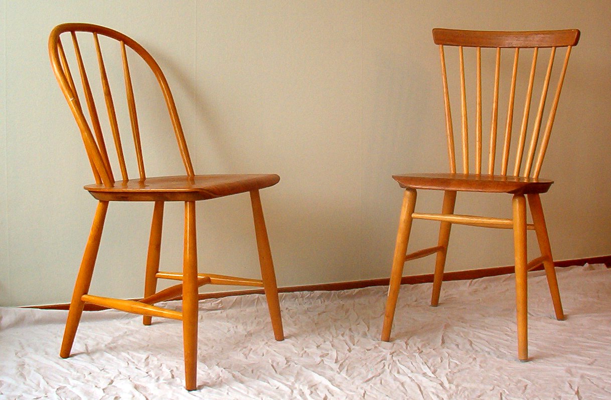 Two wooden Windsor-style chairs