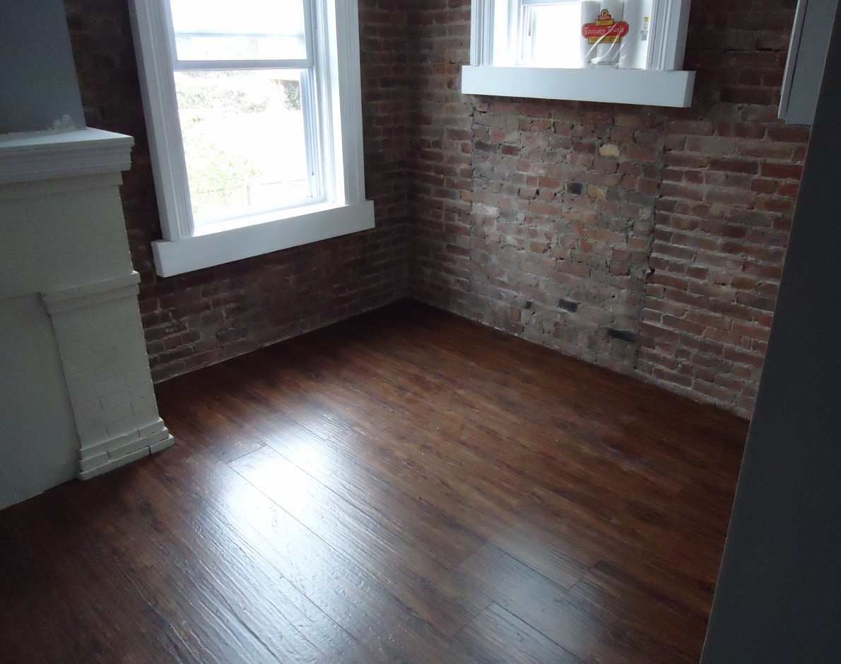 A newly laid dark wooden floor in a kitchen