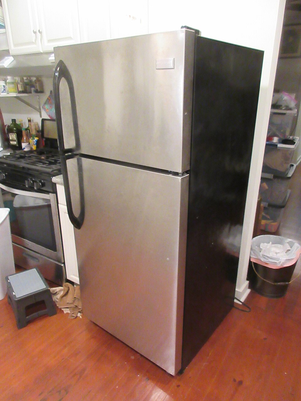 A tall freestanding stainless steel fridge freezer