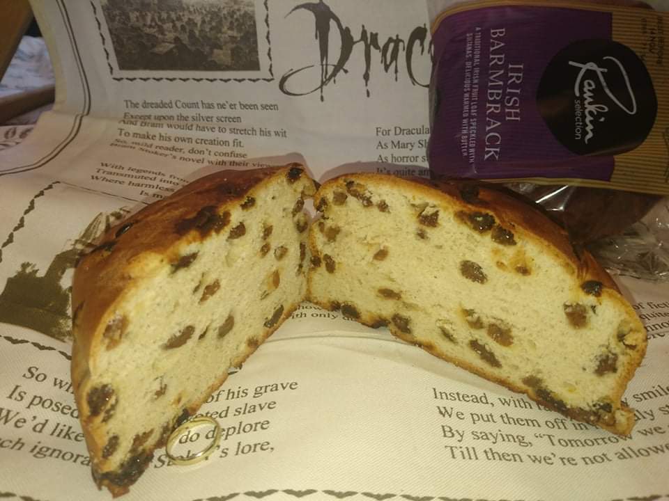 A barmbrack cut open to show the dried fruit inside