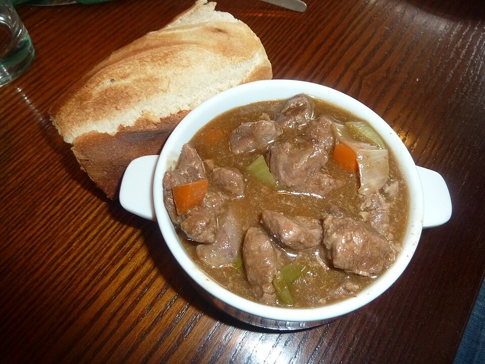 A bowl of meaty Welsh cawl with bread