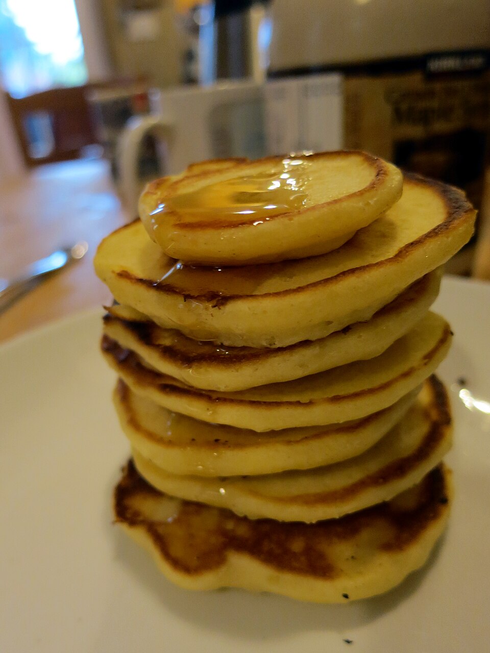 A stack of Scotch pancakes with syrup