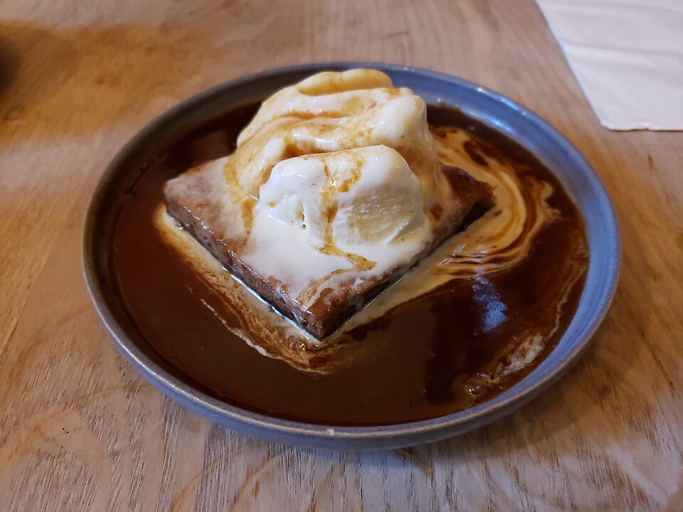 Sticky toffee pudding with ice cream and butterscotch sauce