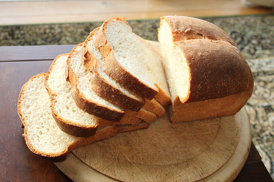A sliced tin loaf, baked in a loaf tin